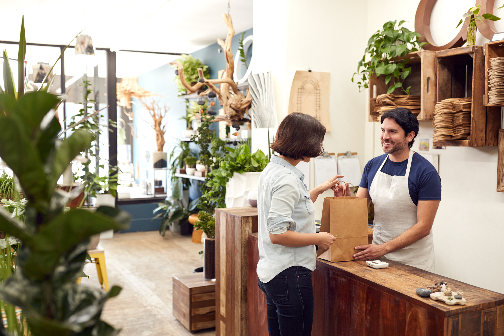 A cashier checking out a customer